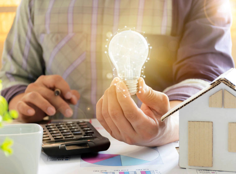 worker holding a lightbomb with a hose model at the right